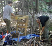 Archeologists excavating a shovel test in the vicinity of one of the officers' quarters, Building 7, October 2006.
